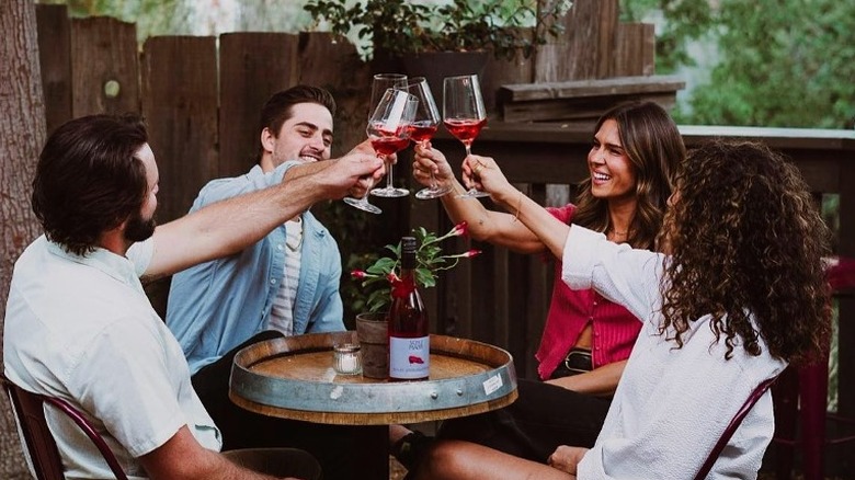 People toasting wine