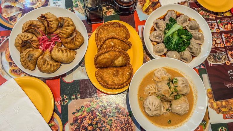 Multiple plates of momos at Lhasa Liang Fen