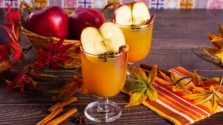 Hot apple cider drinks on table