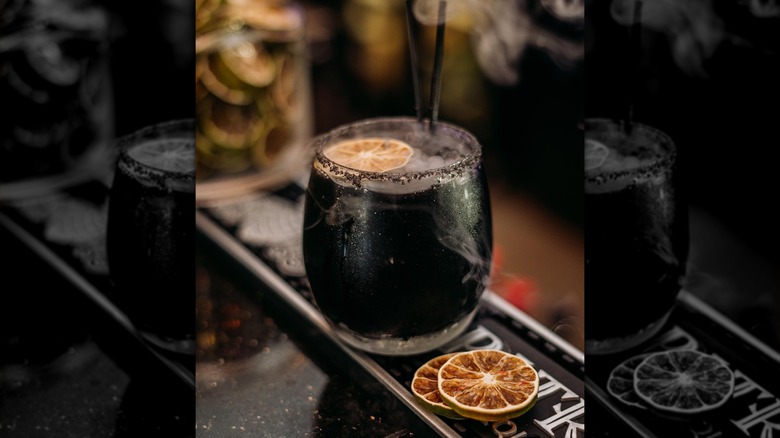 Black margarita on a bar