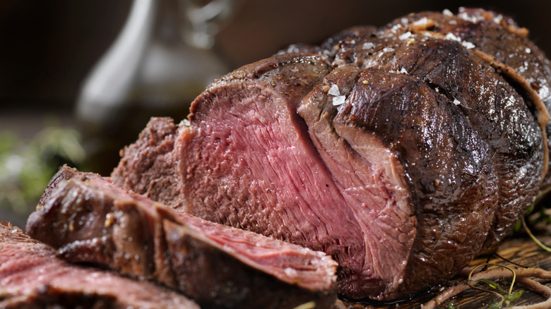 slicing into sirloin tip roast