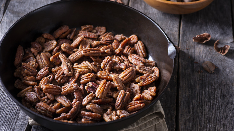 Glazed pecans in skillet