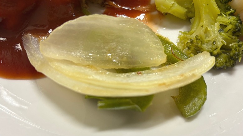 Golden Corral sauteed peppers and onions on white plate