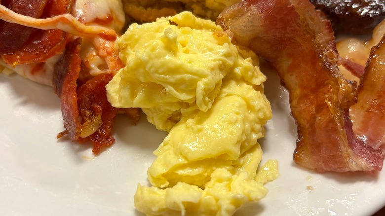 Golden Corral scrambled eggs on white plate