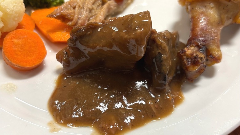 Golden Corral pork and gravy on white plate