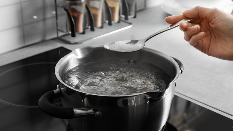 Adding salt to boiling water