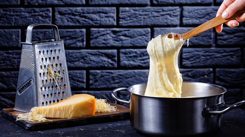 Making pommes aligot potatoes