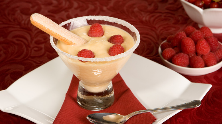 Glass of zabaglione with raspberries 