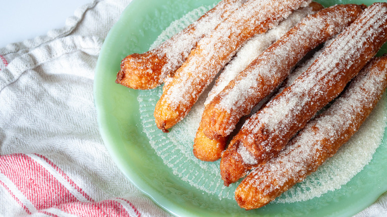 sugary churros on plate