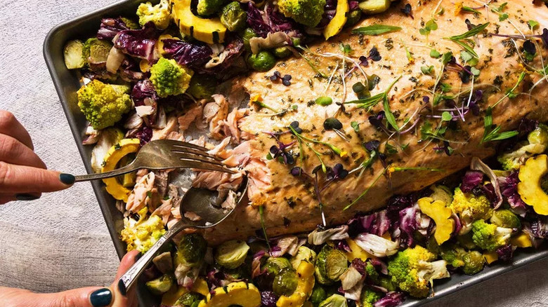 Maple-Glazed Sheet Pan Salmon on pan with fork and spoon