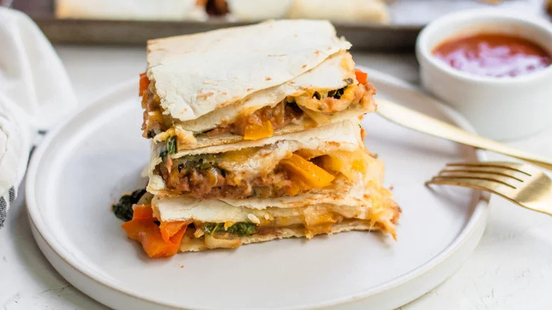 Sheet-Pan Quesadillas stacked on white plate