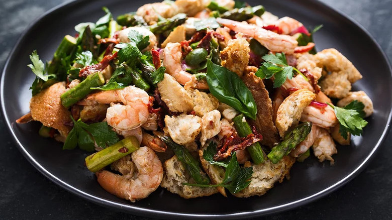 Sheet Pan Shrimp and Vegetables on black plate