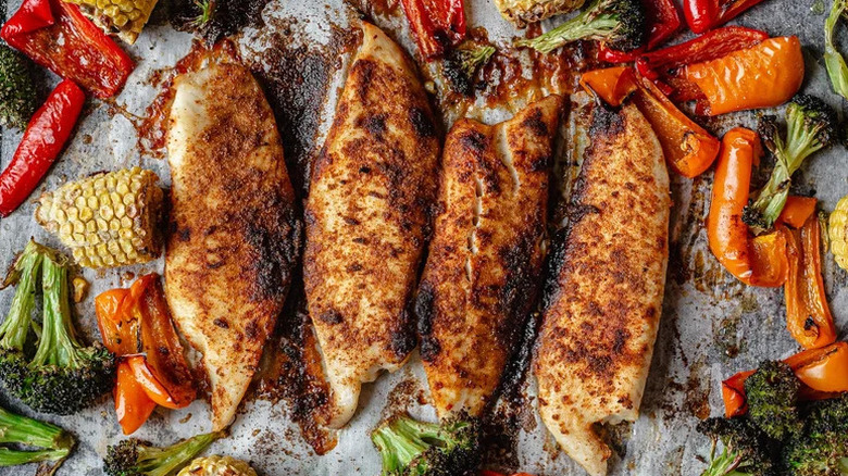 Sheet Pan Smoked Paprika Tilapia arranged on parchment paper