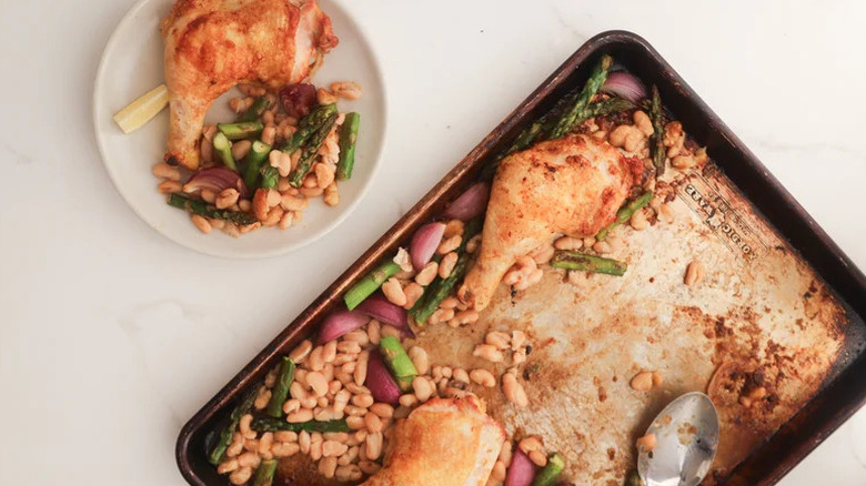 Sheet Pan Spring Chicken with Preserved Lemon on sheet pan and white plate