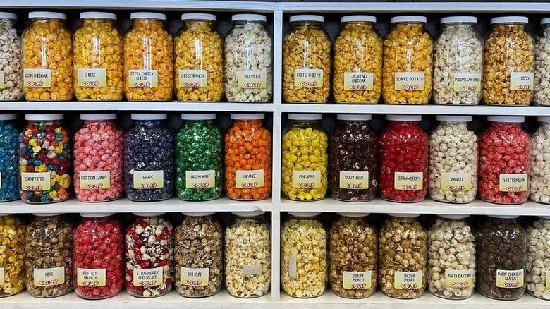 Jars of colorful flavored popcorn