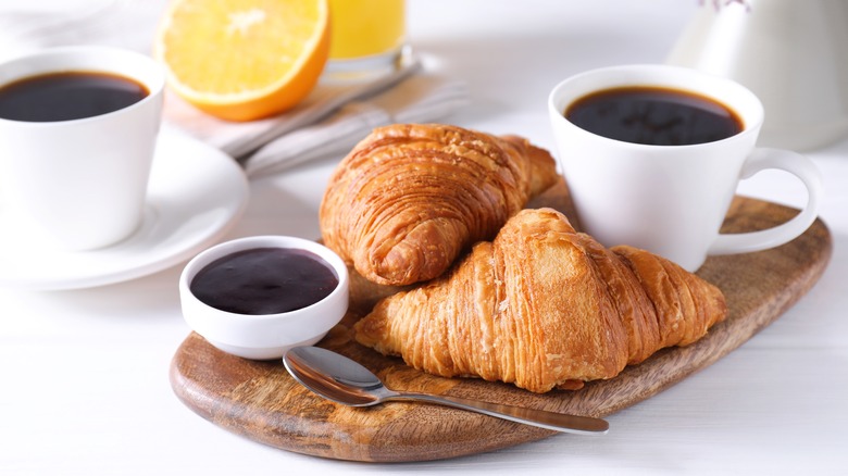 croissants with coffee mugs