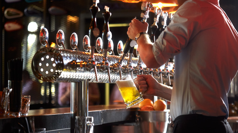 bartender pouring draft beer