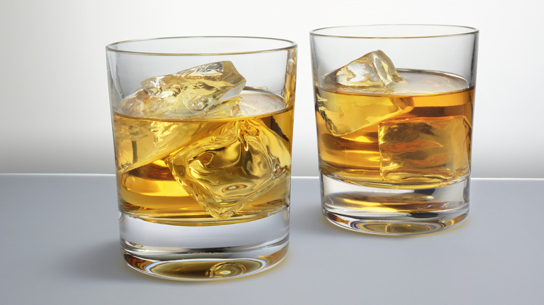 Two whiskey glasses with ice