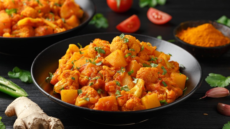 Aloo gobi in black plate