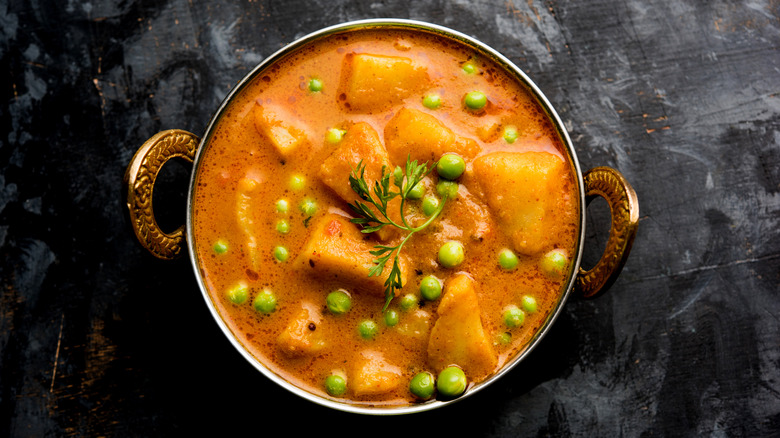 Aloo matar in metal kadai