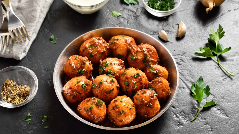 Bombay potatoes in steel plate