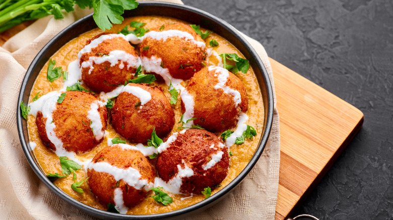 Cream drizzled malai kofta bowl