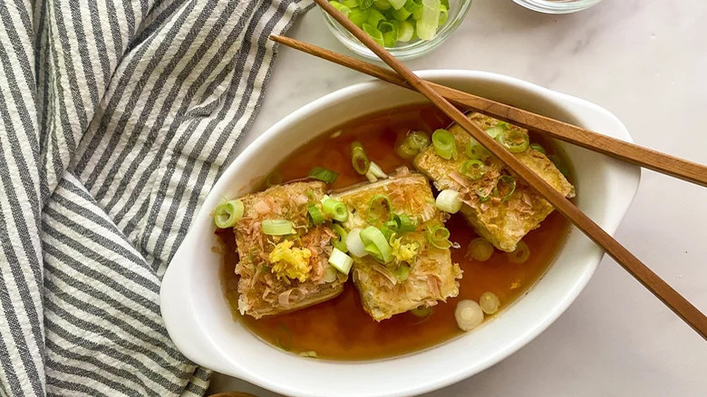 Agedashi tofu with chopsticks