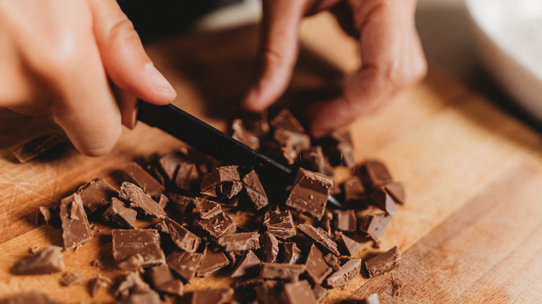 Person chopping baking chocolate