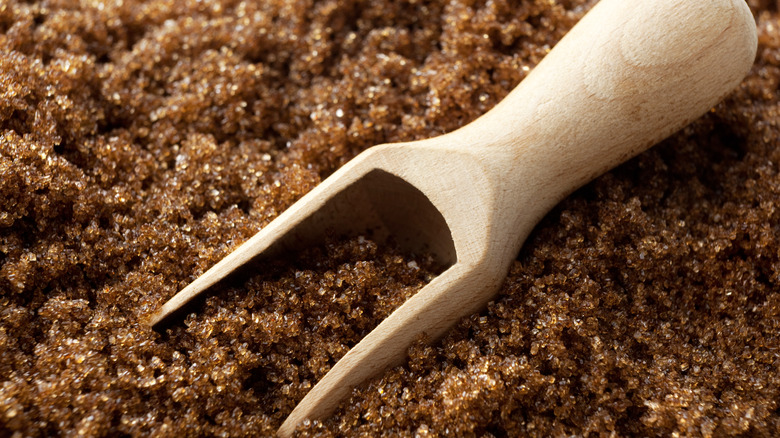 Brown sugar background with spoon