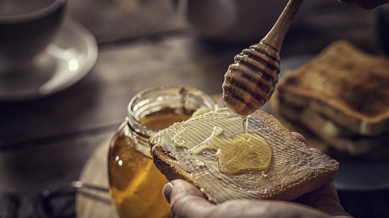 Drizzling honey on toast