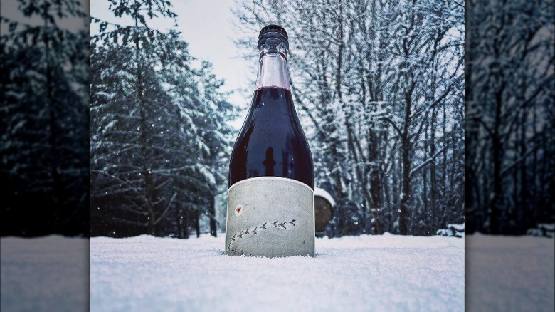 Quebec wine bottle in snow