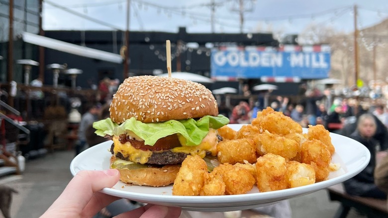 Cheeseburger meal on rooftop bar