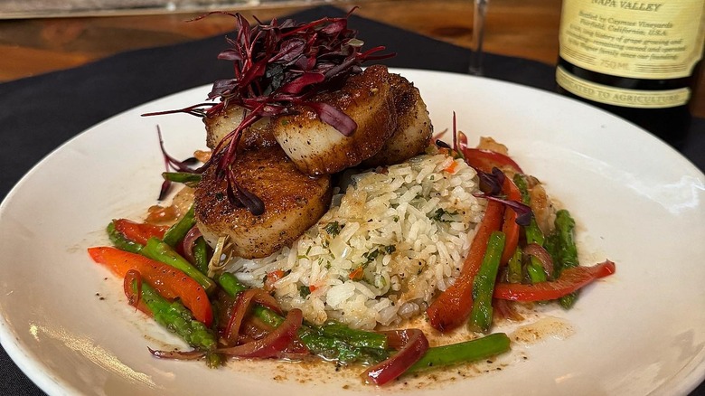 Scallops over rice and veggies