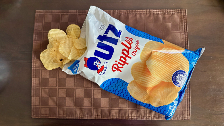 Utz Ripple Original chips on a placemat next to open bag