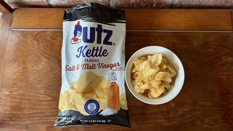 Open bag Utz Kettle Salt & Malt Vinegar chips next to full bowl