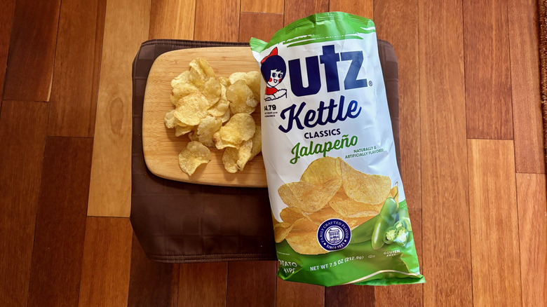 Utz Jalapeño chips on cutting board next to open bag