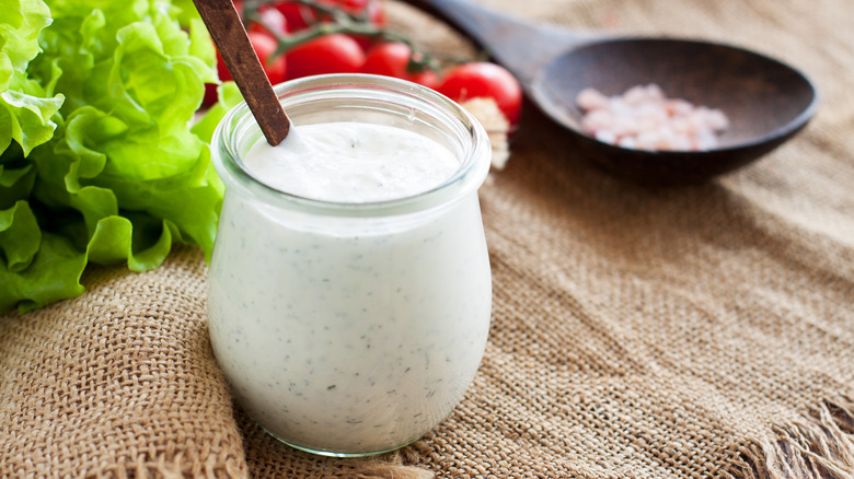 Creamy salad dressing in jar