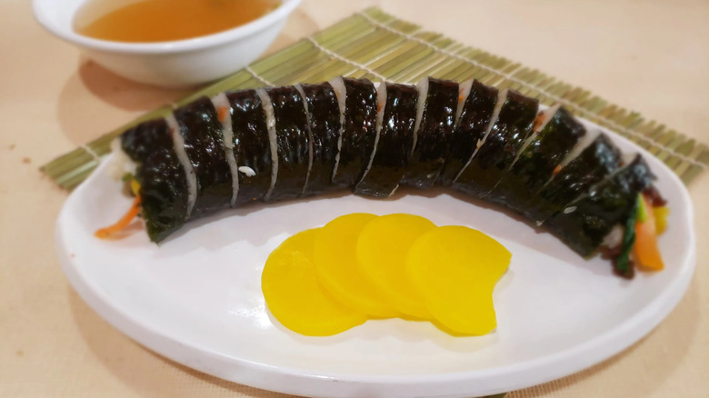 Kimbap on white serving platter