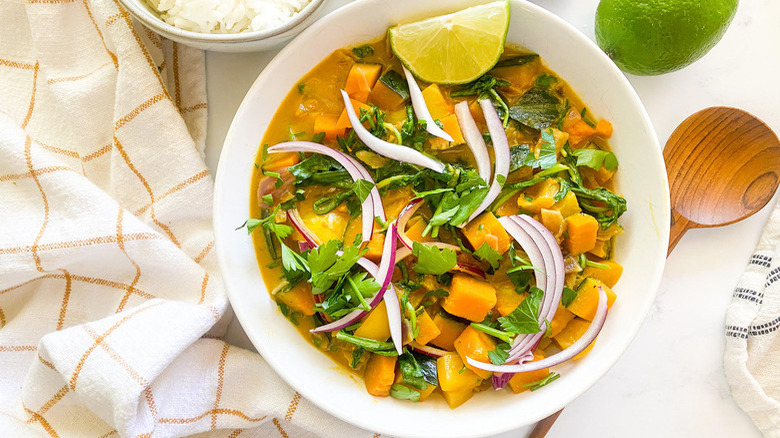 bowl of curry with garnishes