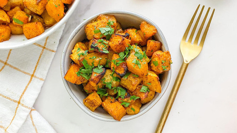 cubed butternut squash with parsley