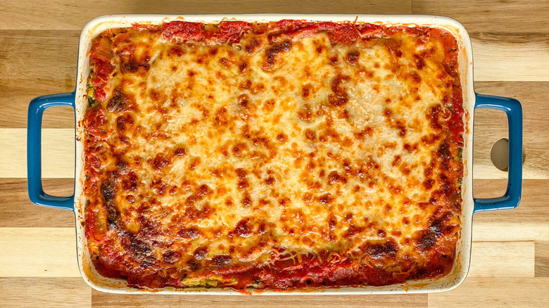 cheesy lasagna in baking dish