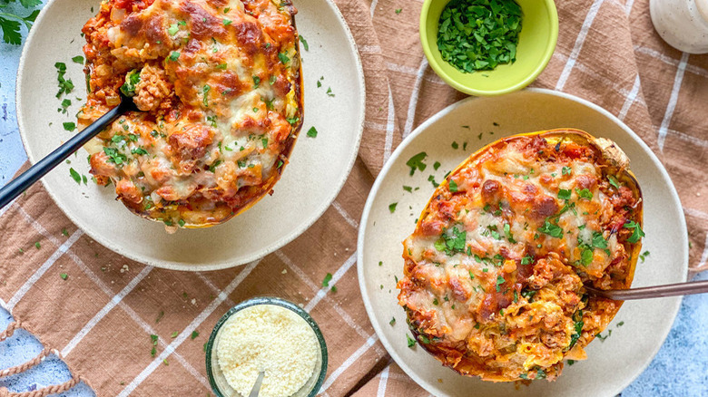 squash lasagna boats on plates