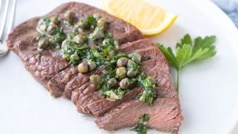 sliced steak herbs and capers