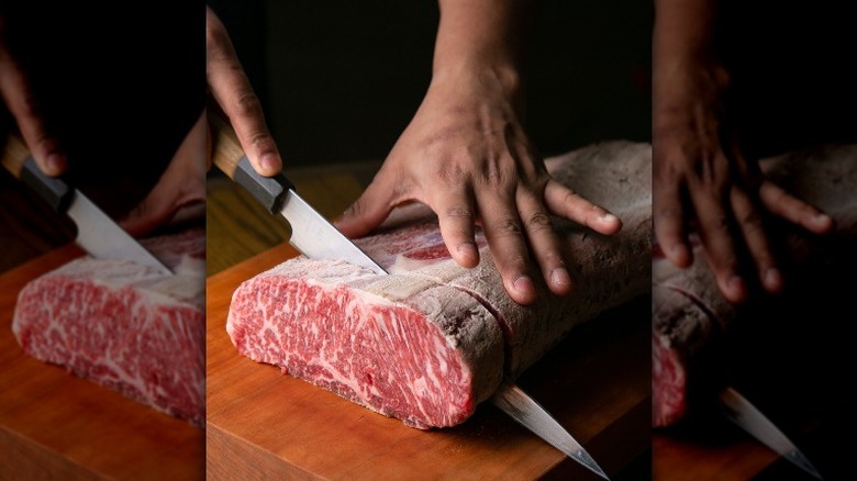 cutting raw steak