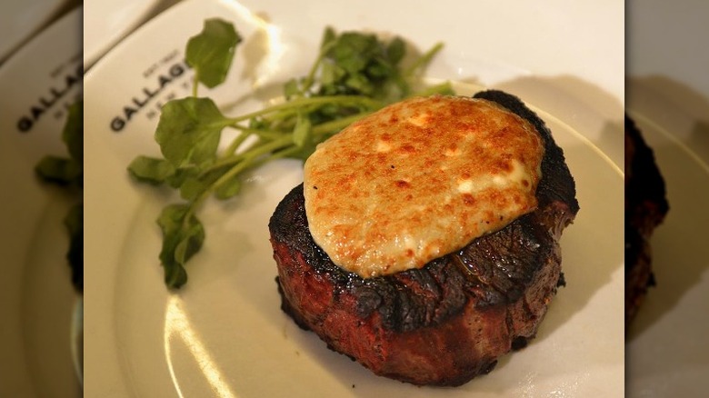 steak with melted cheese