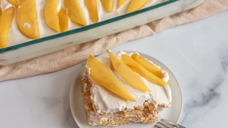 A slice of Filipino mango float on a plate