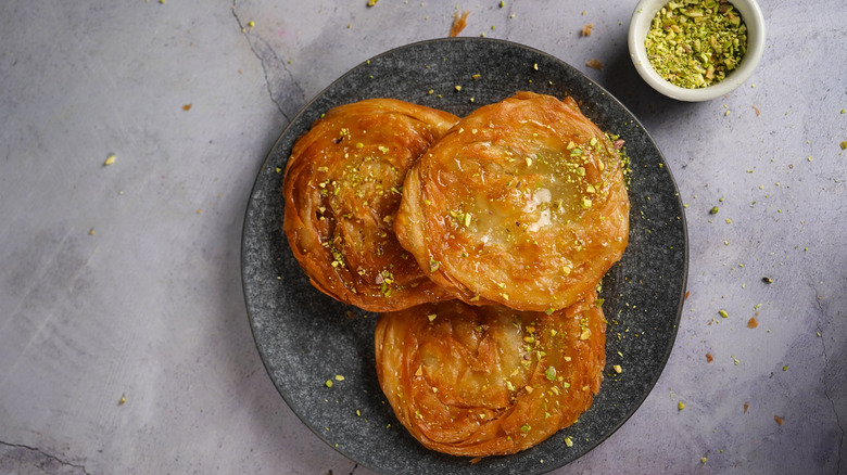 flakey chiroti with pistachio