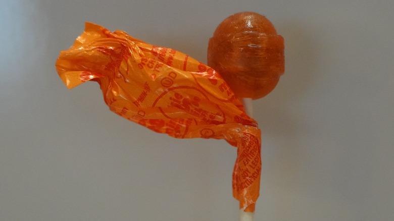 Unwrapped Tangerine Tootsie Pop