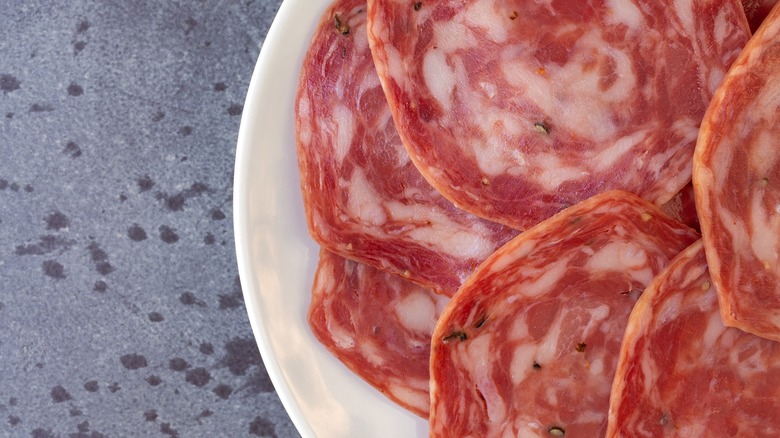 sliced sopressata on a plate