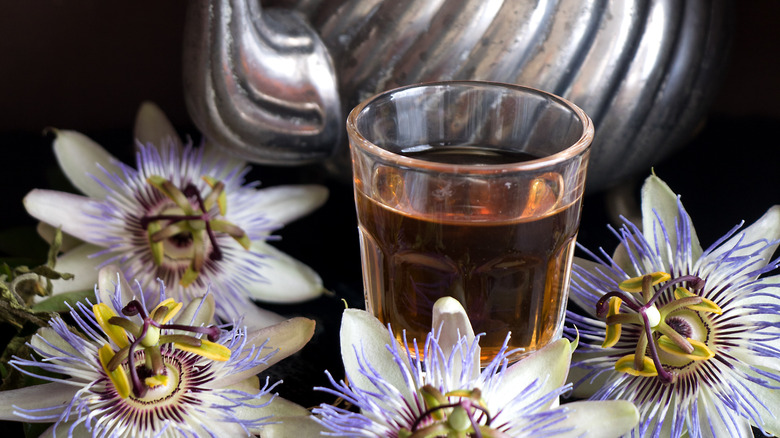 passionflowers around cup of tea